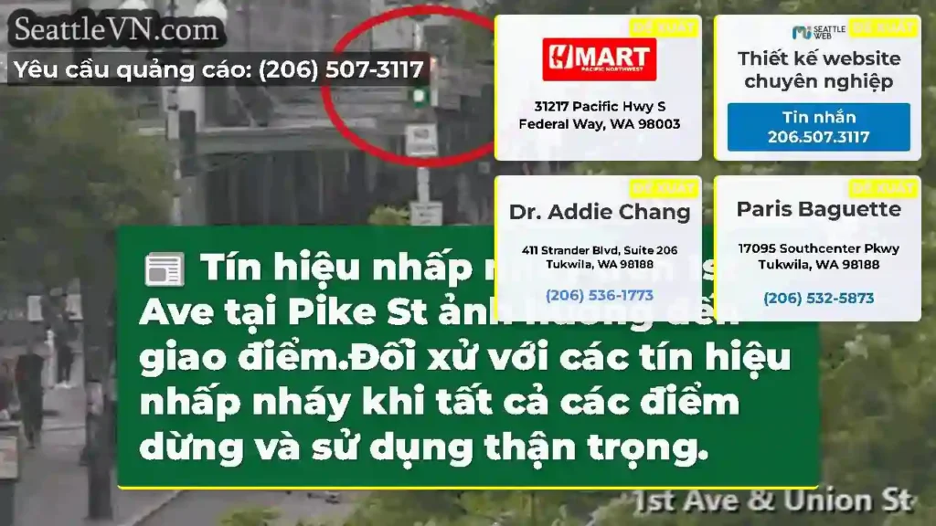 Tín hiệu nhấp nháy trên 1st Ave tại Pike St ảnh
